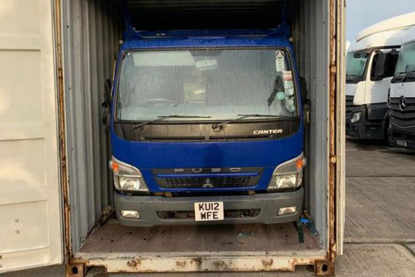 Fuso Canter loaded into shipping container
